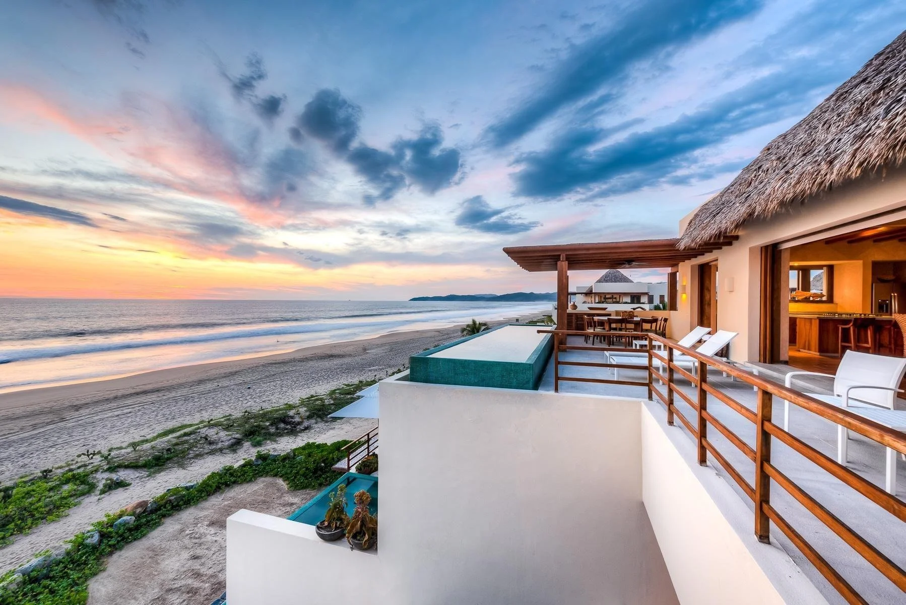 Residential beach access leading to the sand along the Pacific coast of Mexico.