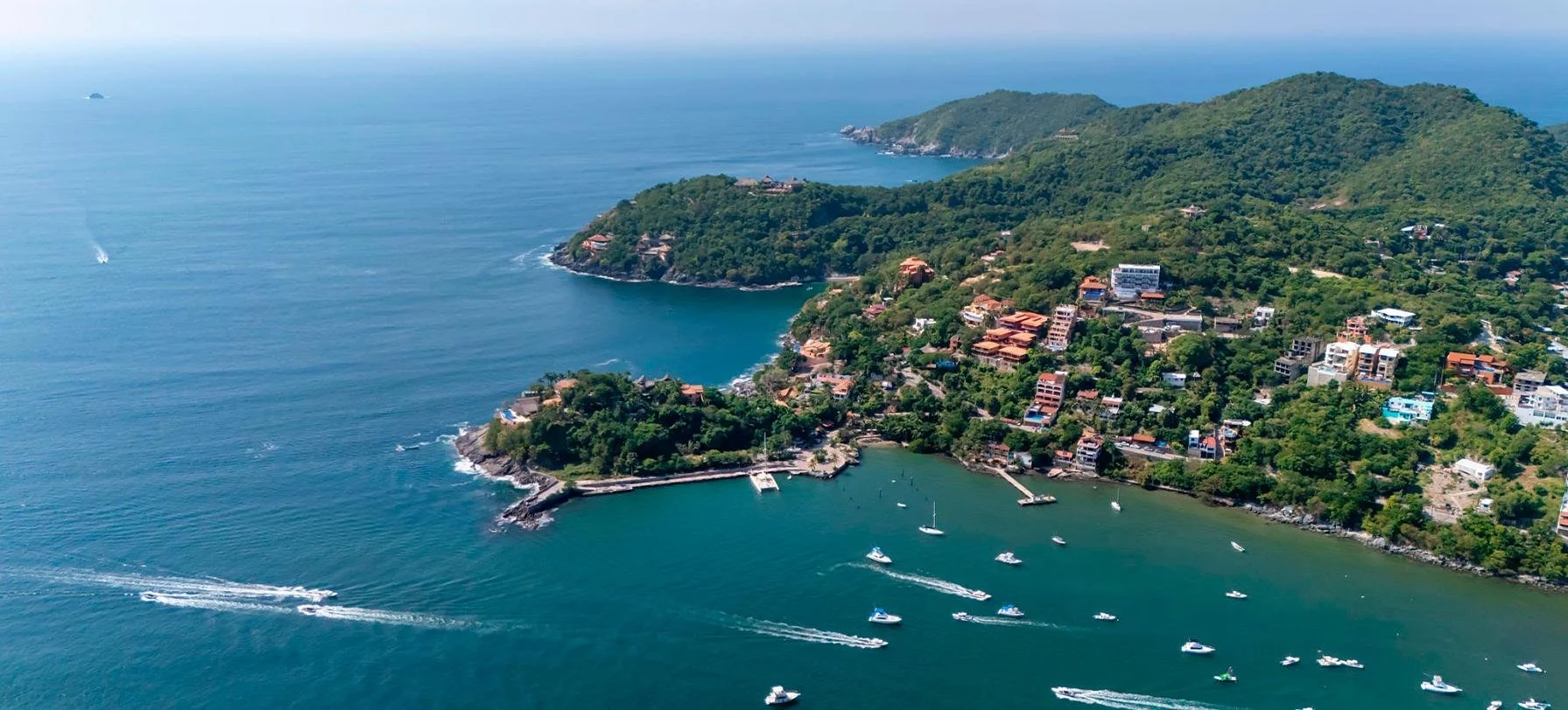 Elevated coastal residences overlooking the beach and Pacific Ocean in Zihuatanejo, Mexico.