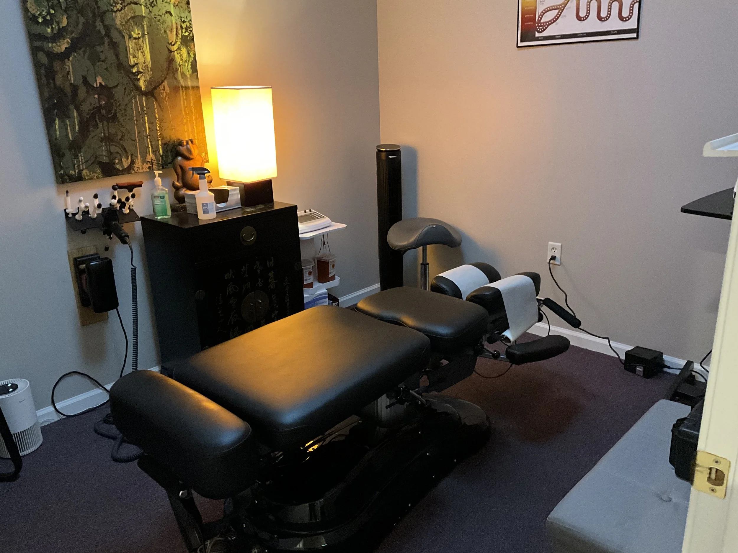 A Chiropractic therapy room with a Chiropractic table.