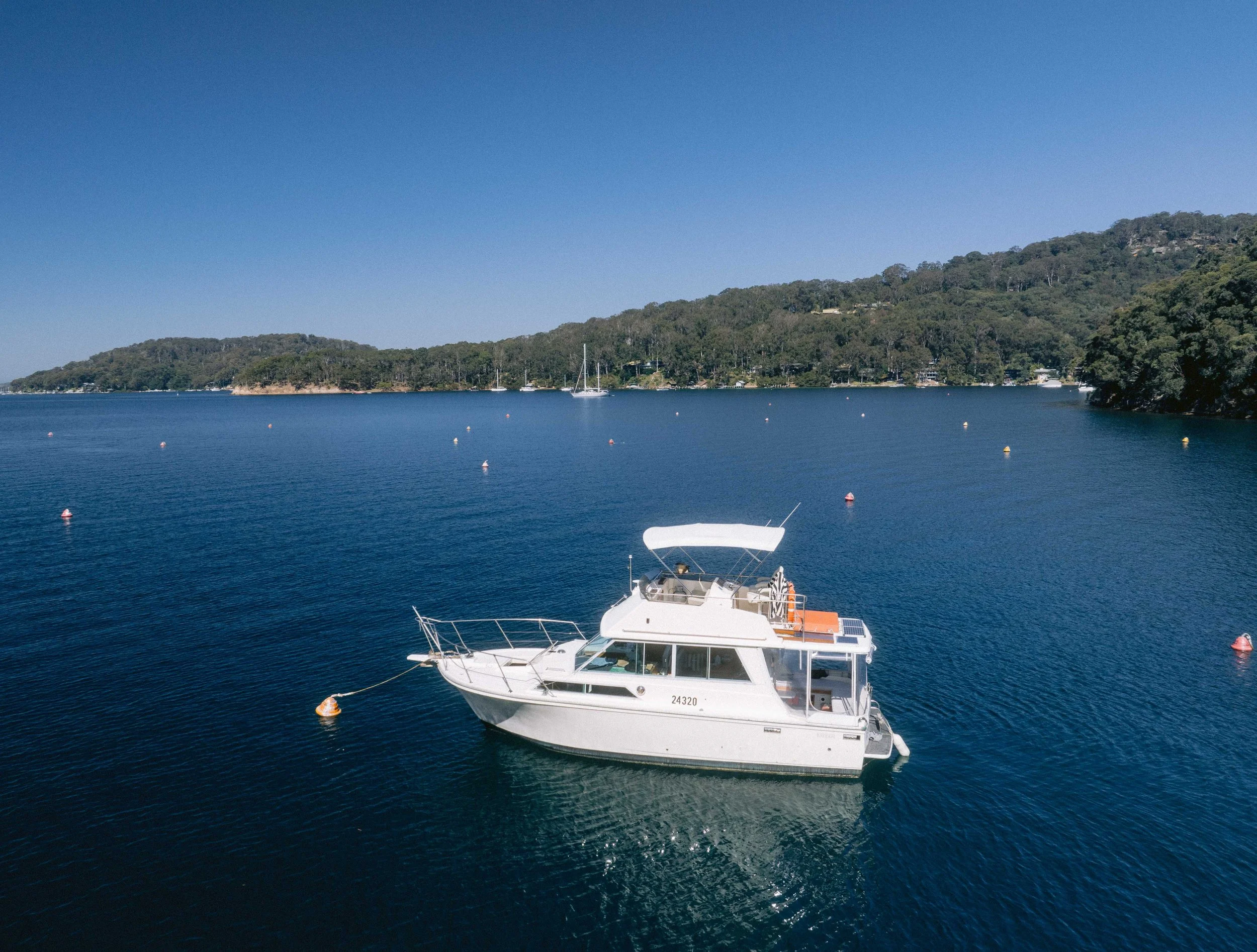 Mariner 31 VIISON anchored in Pittwater. Church Point Charter self-drive charter boat hire