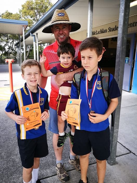 Scott and Brett get certificates and medals.jpg