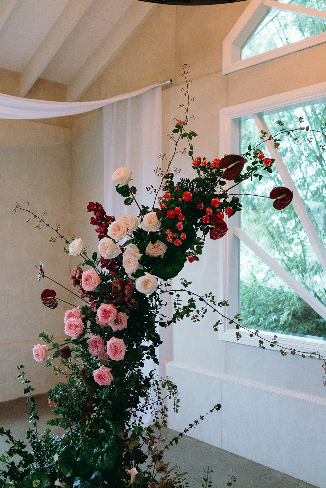 Sunshine Coast wedding florist ceremony flowers with roses, orchids and anthuriums