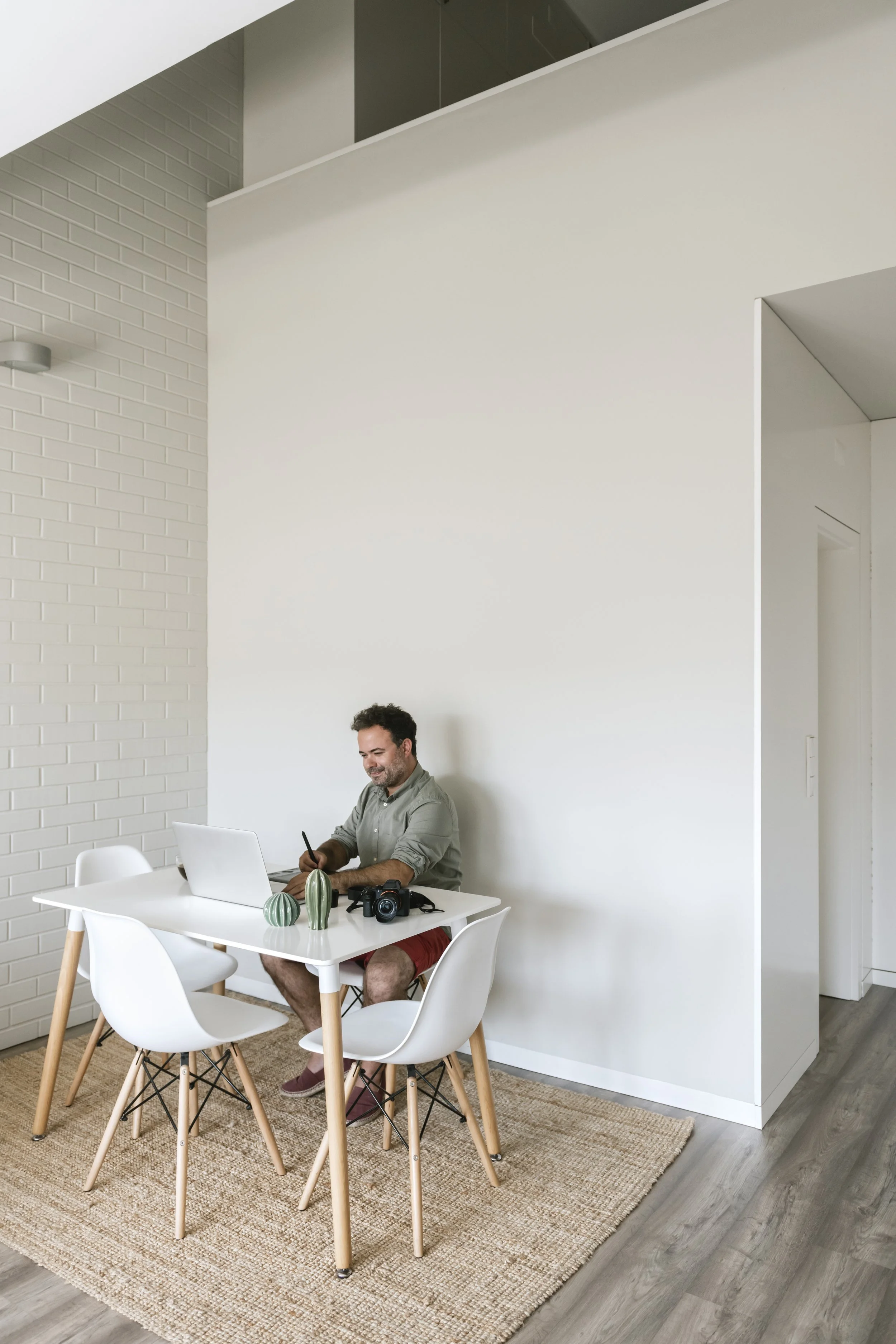 Geometric drawing of an outline square with sections divided by vertical, horizontal, and half circle lines.