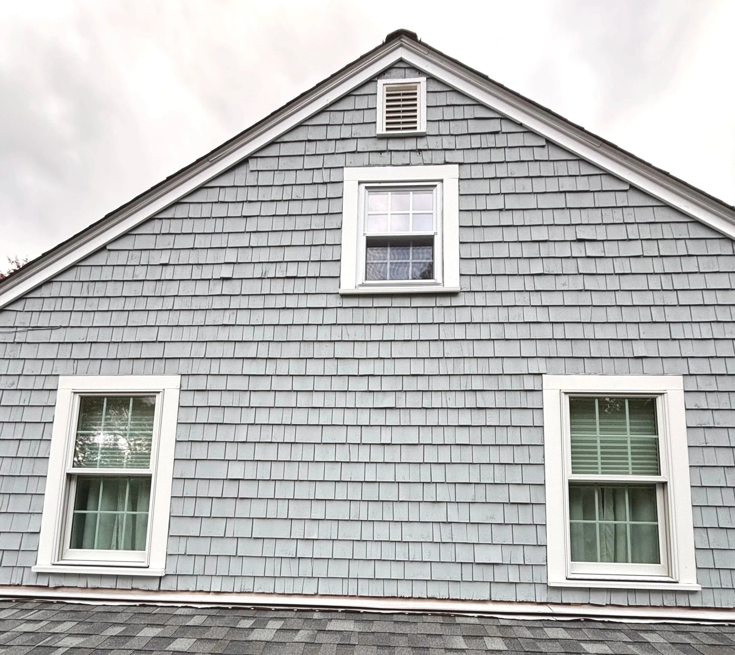 Solid stain on cedar shingles on exterior paint and restoration project in Marshfield, MA