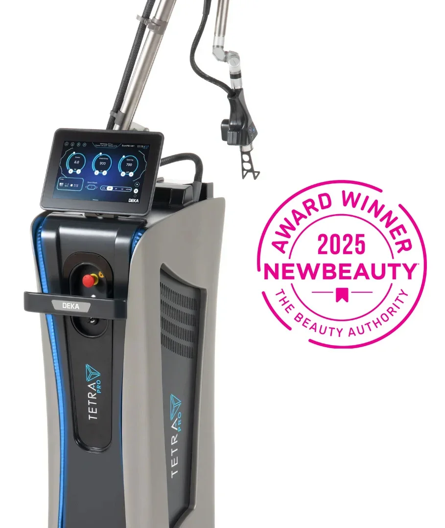 A medical or cosmetic device with a digital touchscreen display and attached robotic arm, branded as TETRA PRO, awarded the 2025 NewBeauty Award by The Beauty Authority.