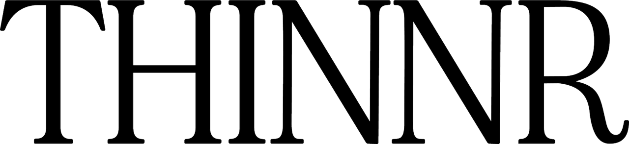 Text that reads 'THINNER' in large, black, outlined letters on a white background.