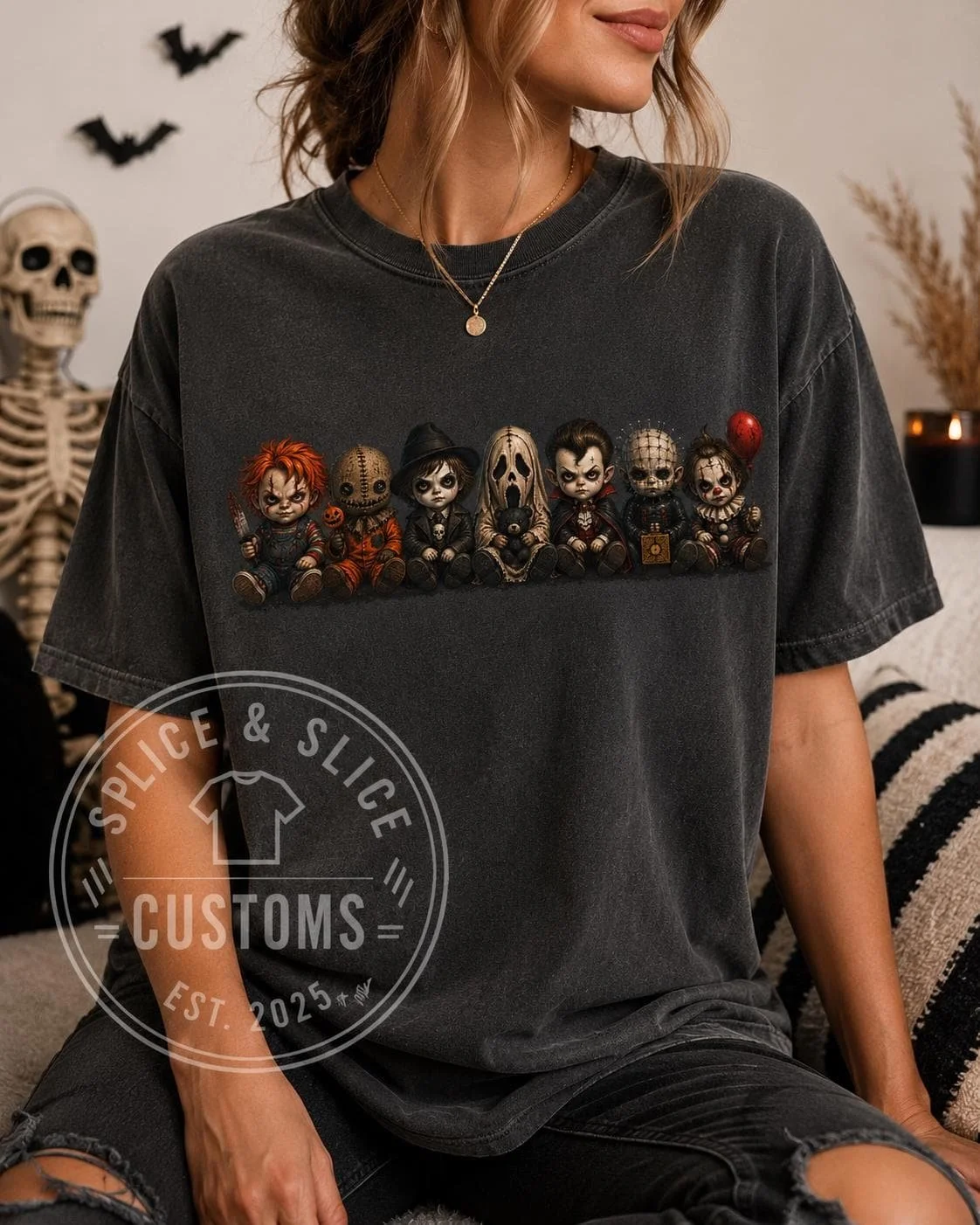 Dark gray t-shirt featuring a graphic of seven cartoon-style horror movie villains sitting in a row.