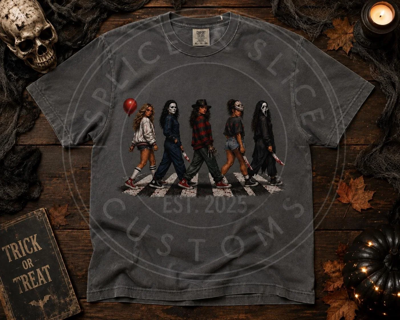 Gray t-shirt featuring a graphic of five women dressed as iconic horror movie villains walking across a crosswalk.