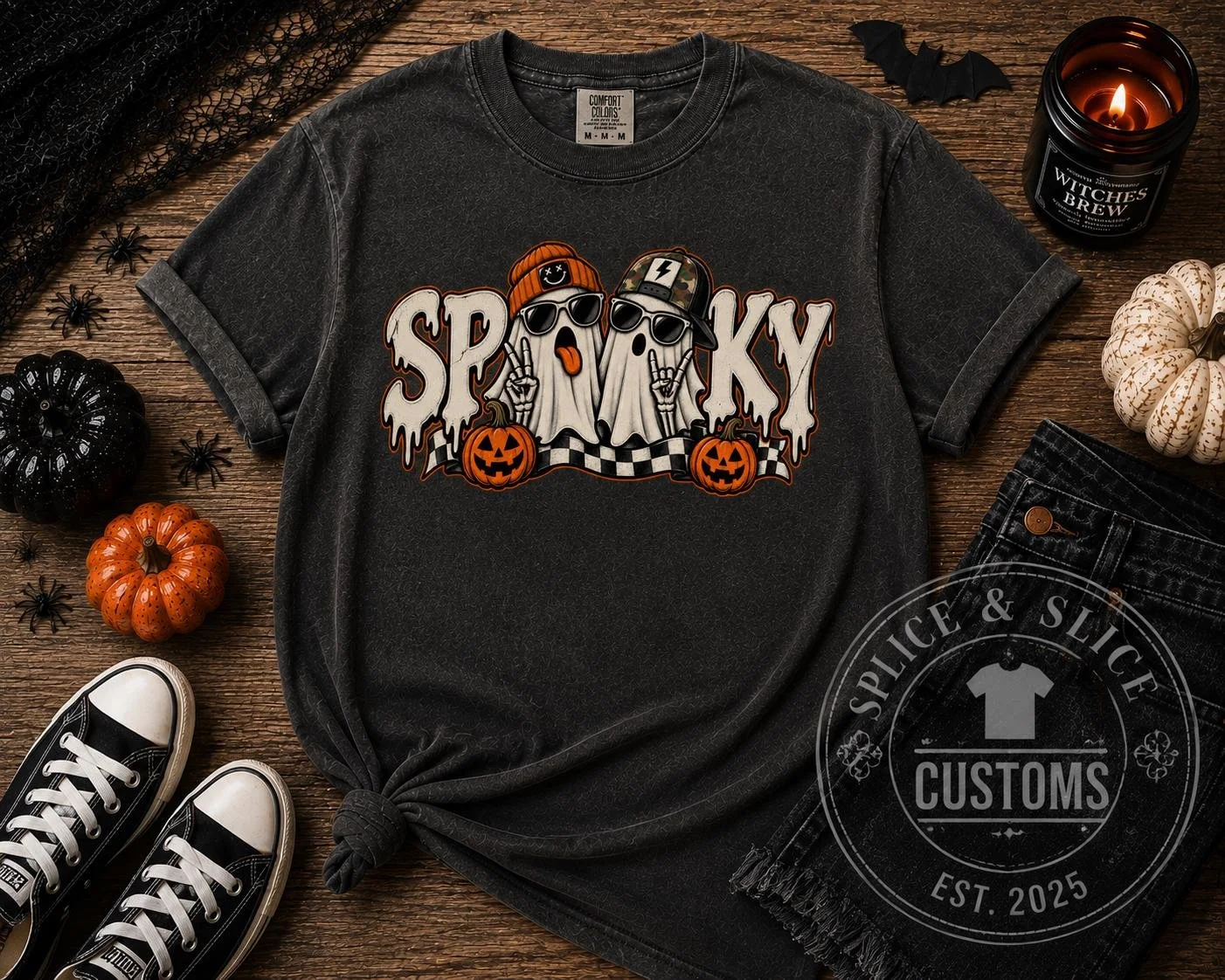 Charcoal gray T-shirt with a graphic of two ghost characters wearing hats and sunglasses, with the text SPOOKY and small pumpkins.