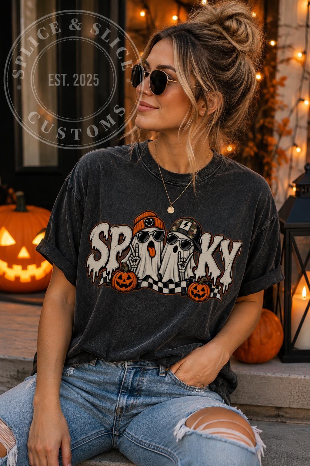 Charcoal gray T-shirt with a graphic of two ghost characters wearing hats and sunglasses, with the text SPOOKY and small pumpkins.