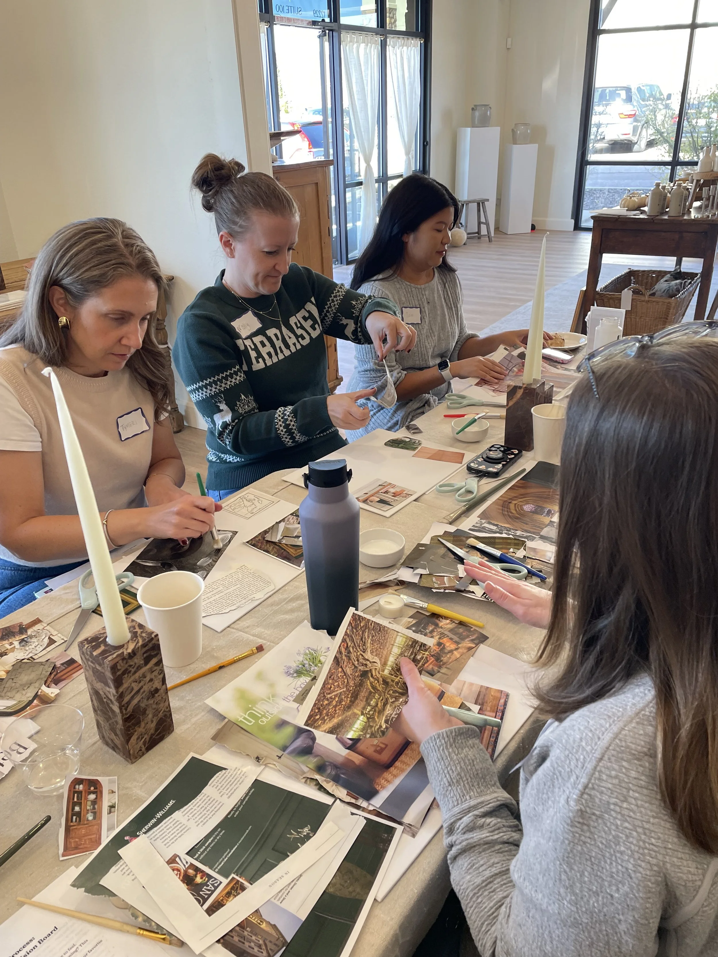 Women participating in a vision board workshop, dreaming up their ideal reading nook in their homes.