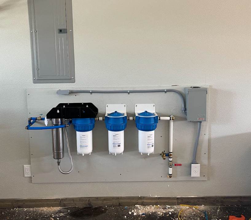 3-stage rainwater filtration system with UV light sterilization and pressure pump installed by Reinewater Solutions in San Saba Co.