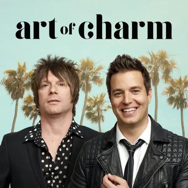 Cover of the 'Art of Charm' podcast featuring two men, one with messy hair and a serious expression, the other smiling, with a background of palm trees.