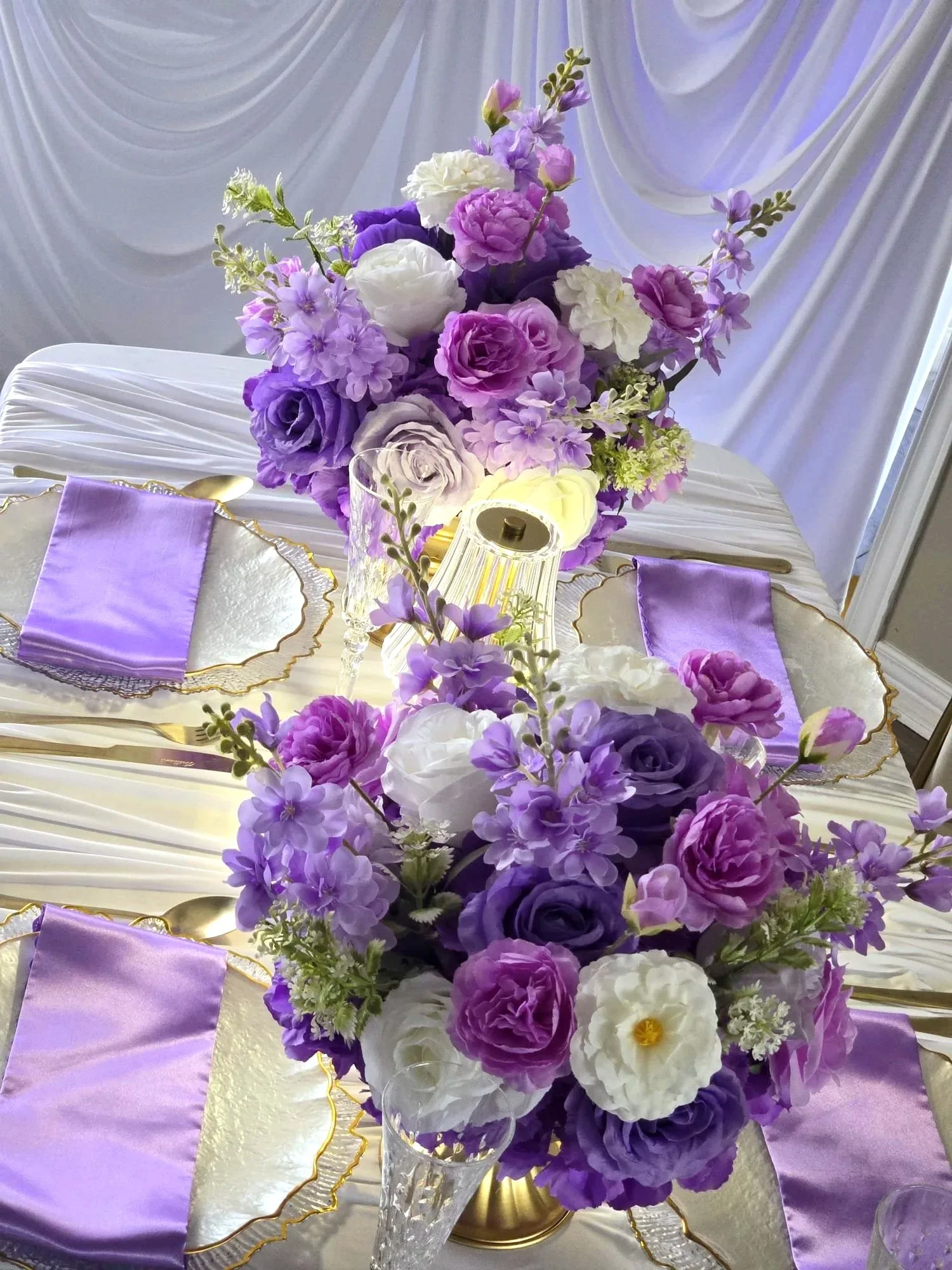 Purple and white table set up