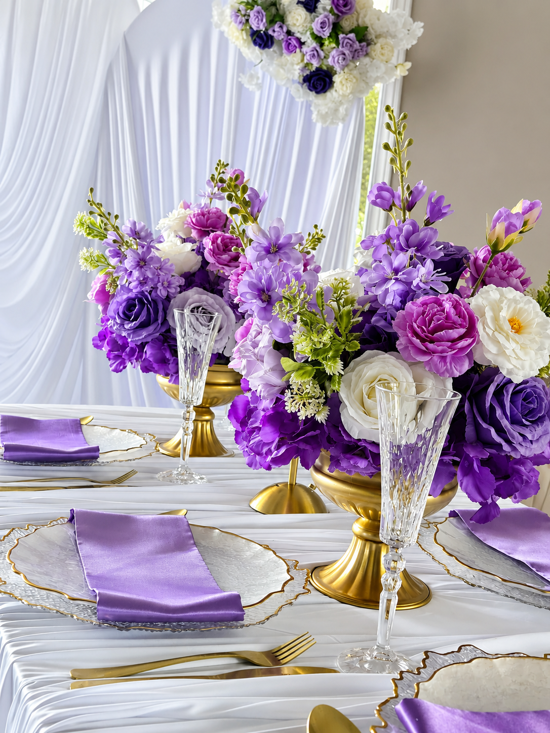 Purple and white with a touch of gold, table set up