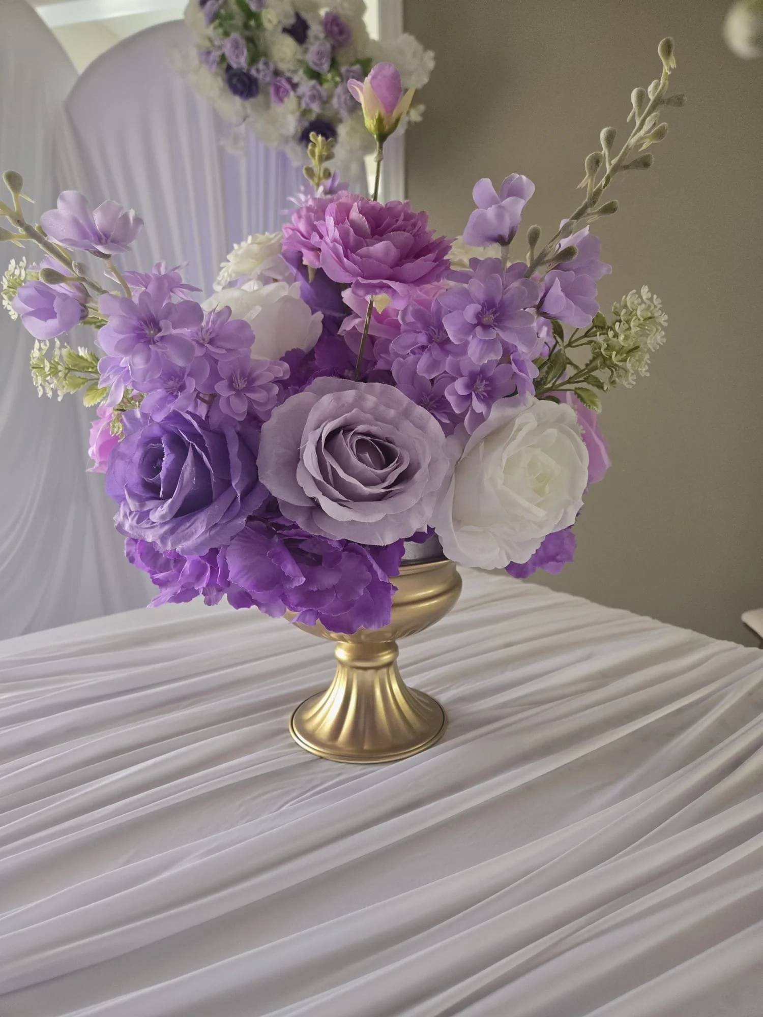 Gold vase with flowers.jpeg