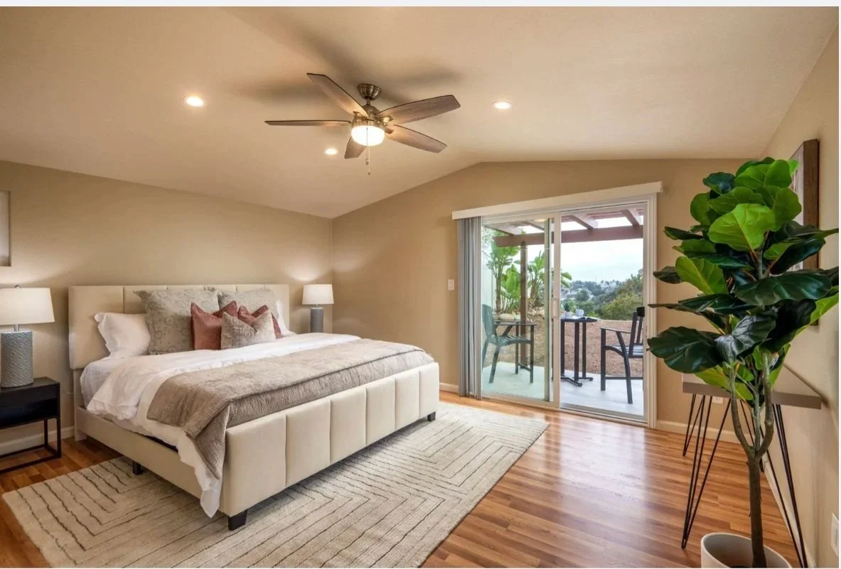 airbnb staged bedroom design with natural light and balcony access in San Diego home
