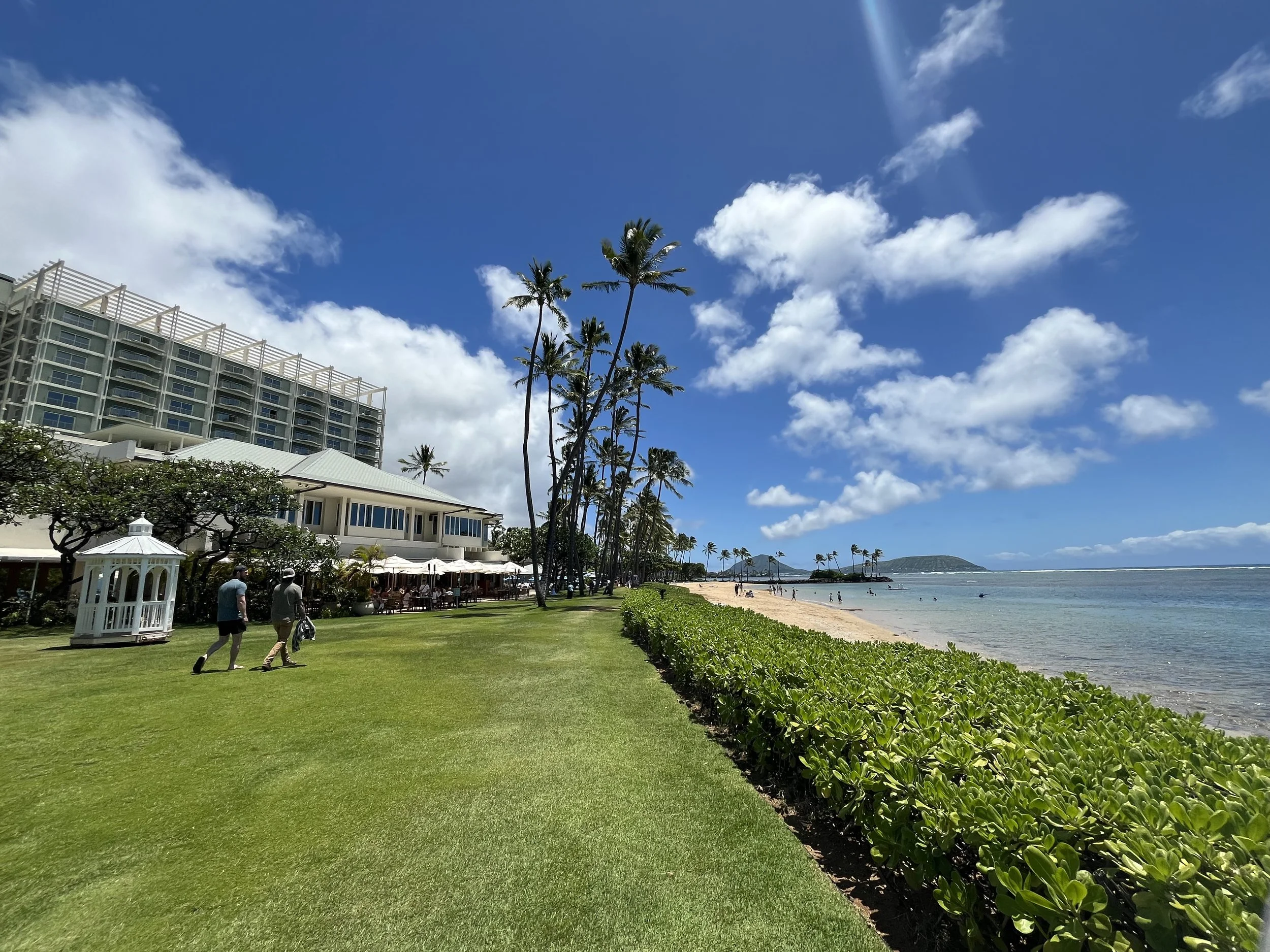 exterior landscape shot of the restaurant and beach area of the Kahala Resort