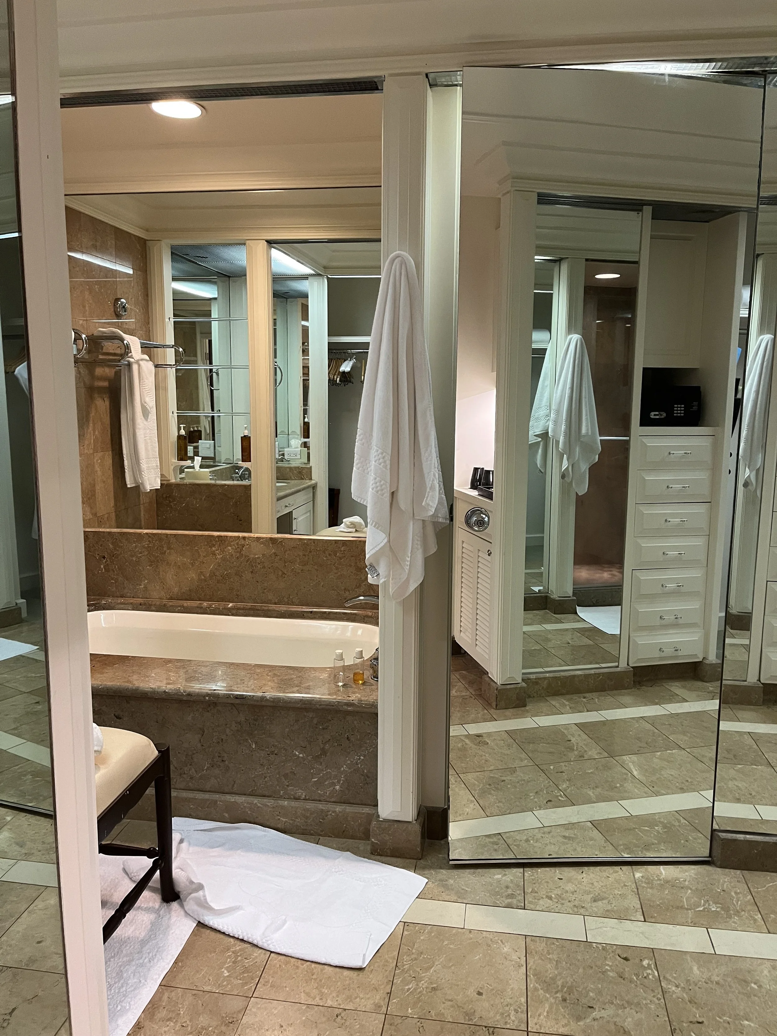 beautiful bathroom with mirrors and bath at the Kahala Resort