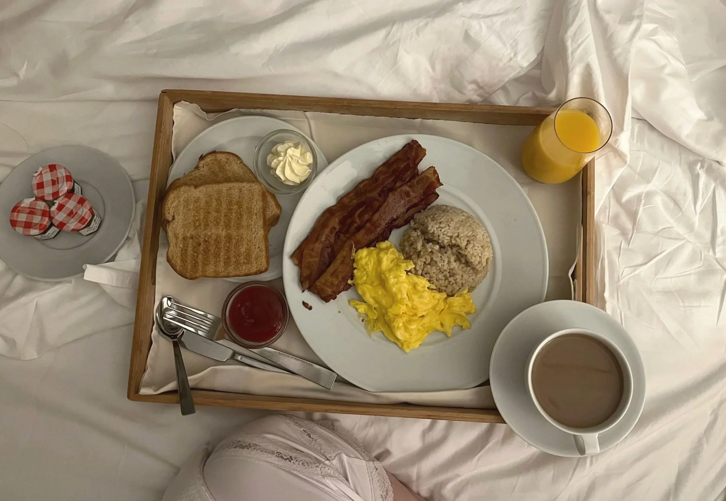 breakfast from in-room dining service of scrambled eggs, bacon, brown rice, coffee and toast at the Kahala Resort