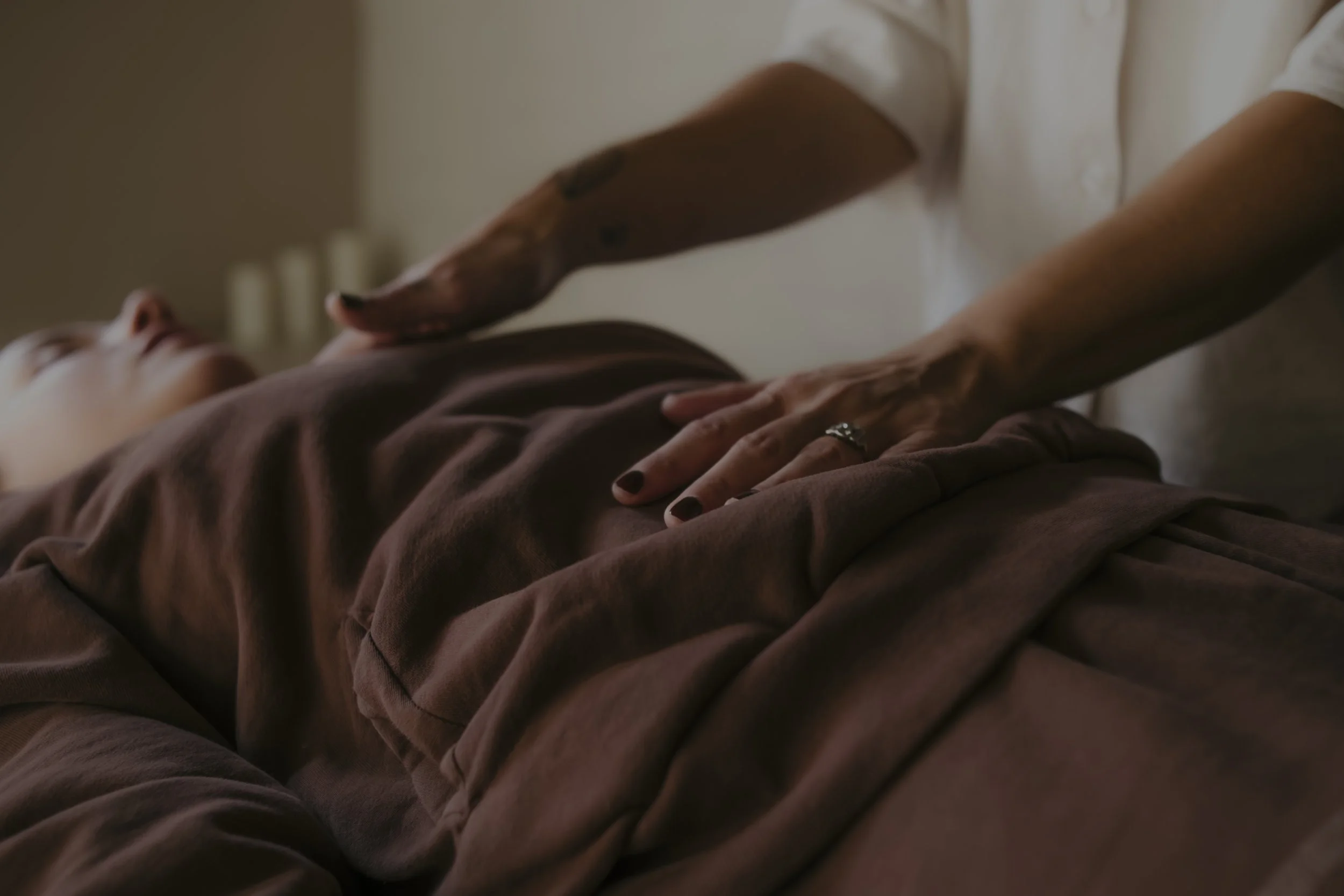 Person receiving a nervous system awareness treatment.