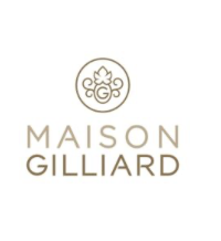 Logo de la Maison Gilliard avec un symbole circulaire floral en haut et le texte en dessous.