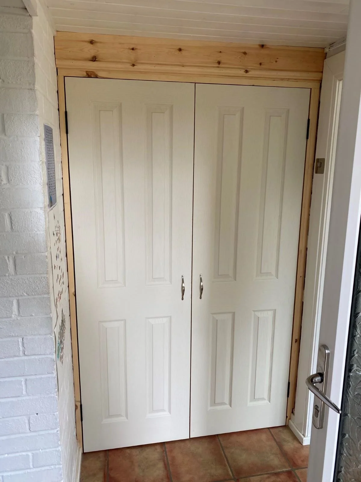 White double internal doors with wooden framing handmade by local wood carpenter