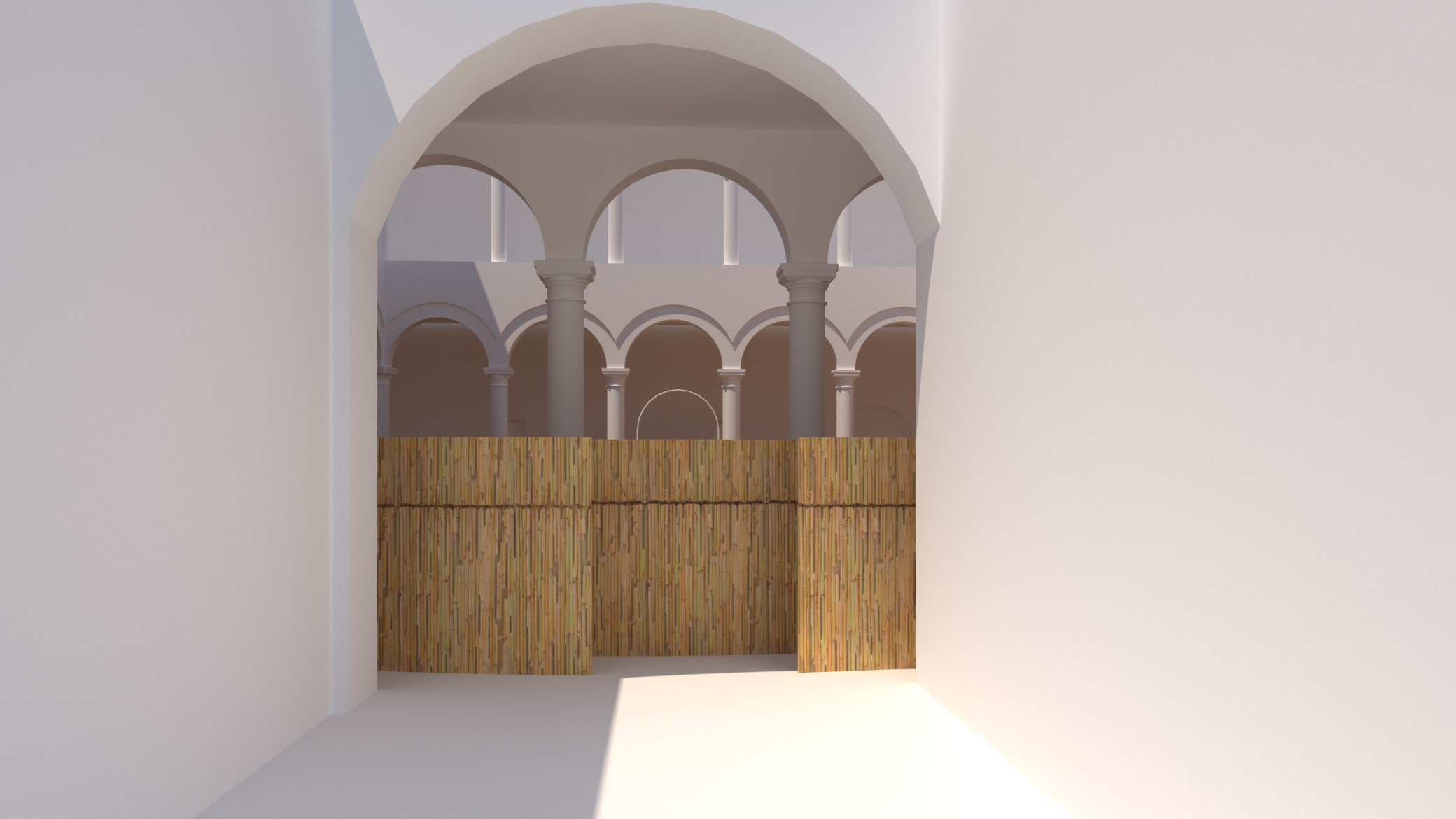 A view through an archway showing a courtyard with white columns and arches, and a bamboo fence in the foreground.