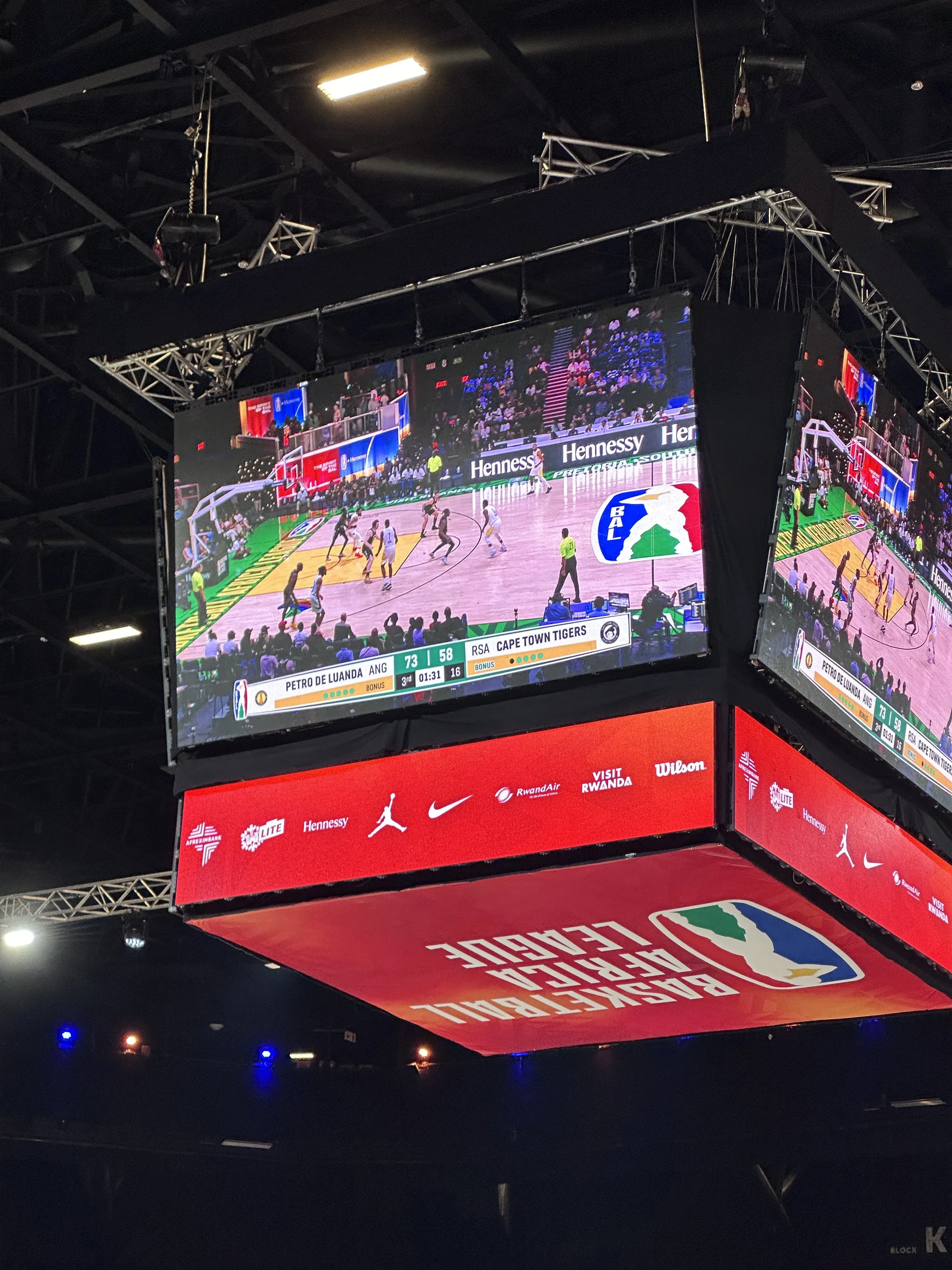 Large electronic scoreboard display showing a basketball game between Petro de Luanda from Angola and RSA Cape Town Tigers, with the score 73-58, and 1 minute and 31 seconds remaining in the third quarter.
