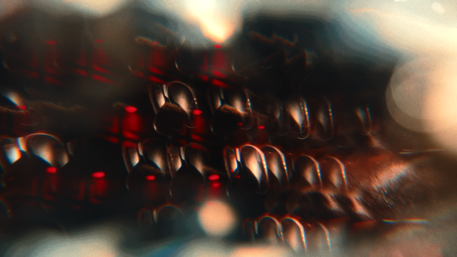 Close-up of a vintage typewriter with black keys and red accents, slightly blurred with a shallow depth of field.