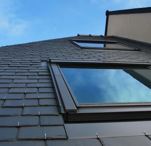 Slate and tile roofing restoration on a pitched roof