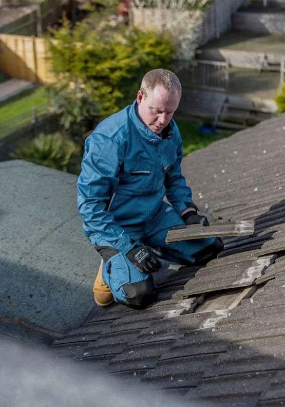 Worker installing new roofing tiles, illustrating Stork Roofing repair services in Aberdeen and Aberdeenshire