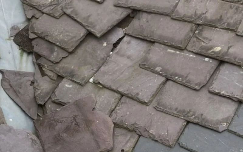 Slipped slate roof tiles in a valley on a property in Aberdeen showing need for roof repair or replacement