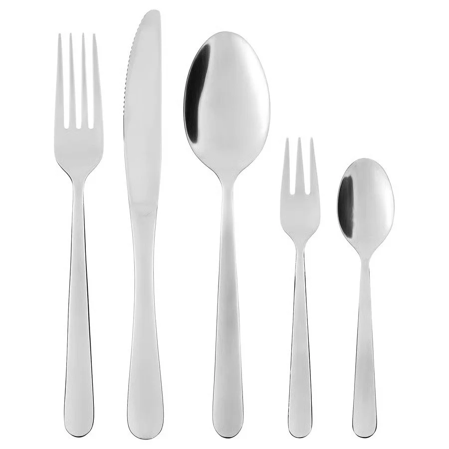 Set of stainless steel forks, knives, and spoons arranged in a row on a white background.
