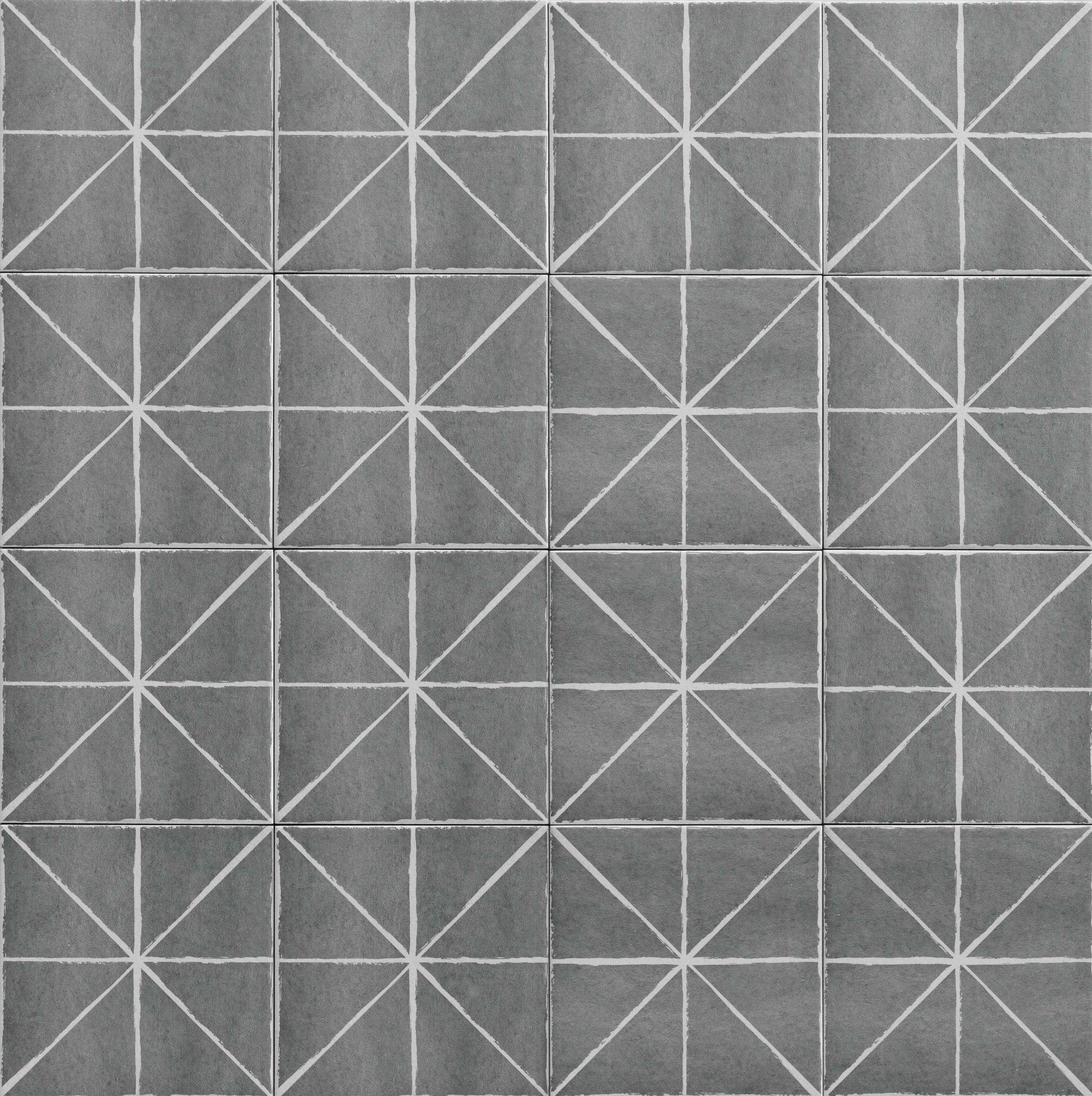 A grid of gray concrete tiles with white chalk lines drawn in geometric patterns.