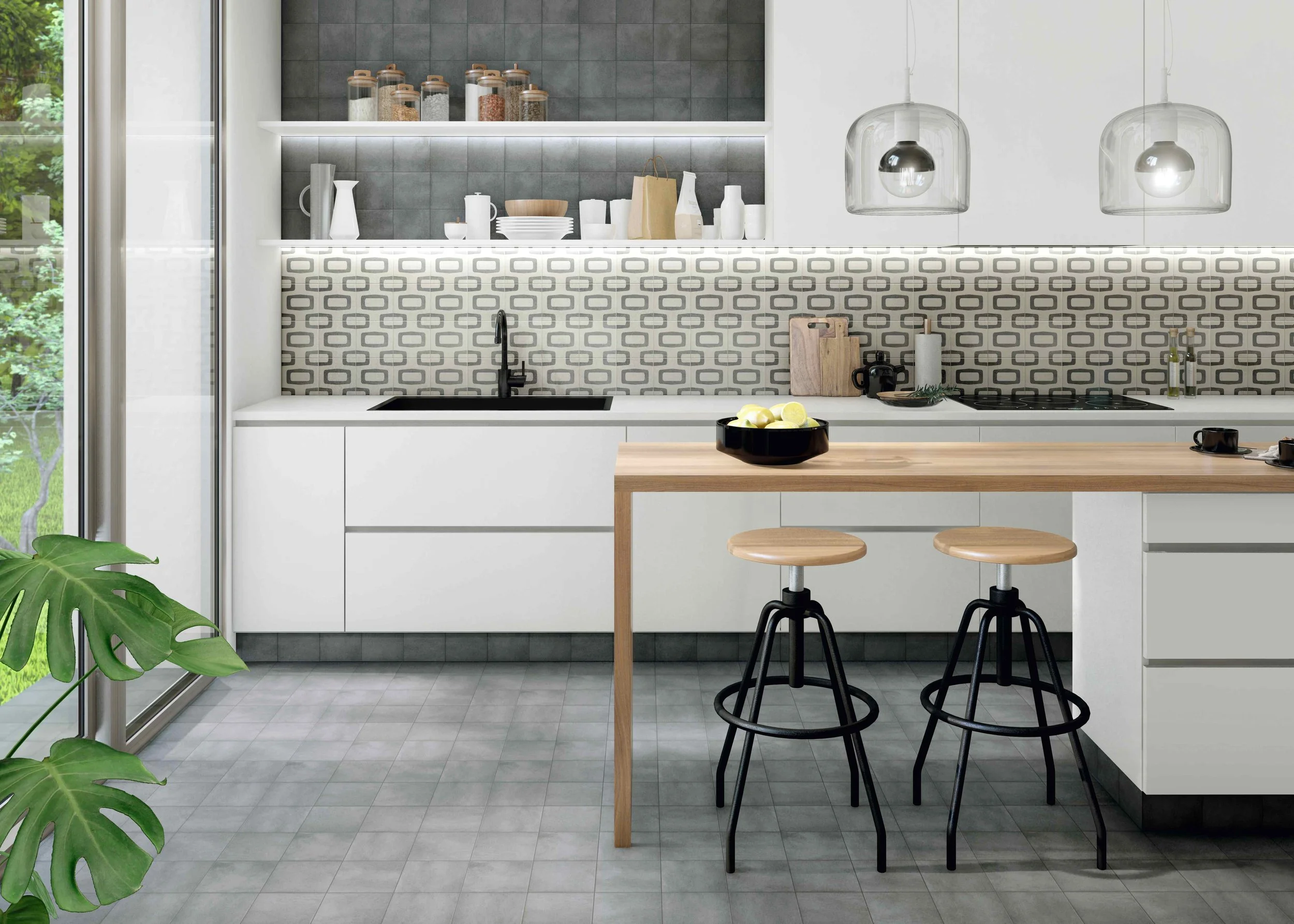 Modern kitchen with white cabinets, open shelves, black faucet, patterned backsplash, wooden table with two stools, black bowl with lemons, and greenery outside through a sliding glass door.