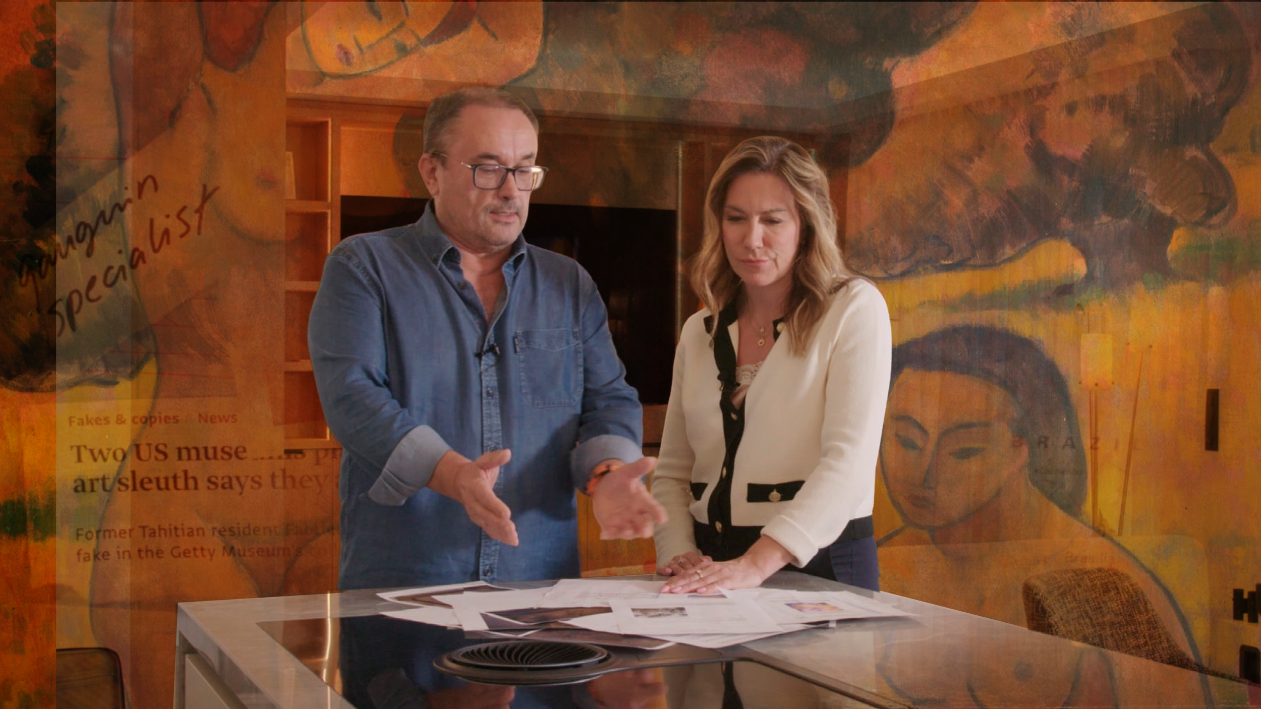 Reflections of Gauguin - Film photo. Two people, a man with glasses and a woman, standing behind a table covered with papers, engaged in conversation, with a colorful mural or painting in the background.