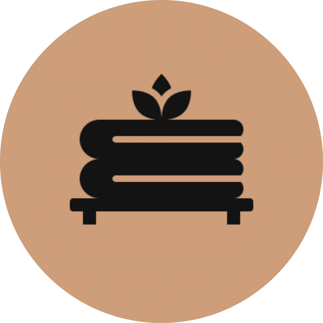 Icona stilizzata di un comò in legno con una pianta sopra.