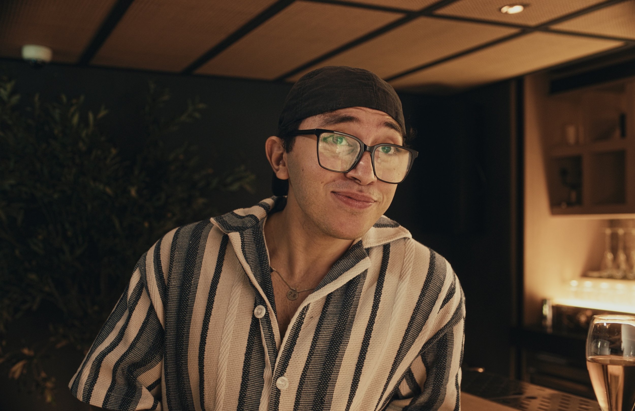 An image of a man smiling in a restaurant