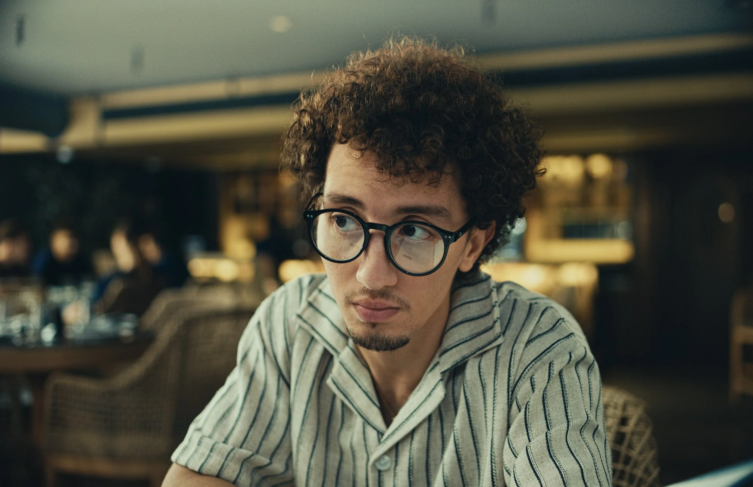 an image of a man confused in a restaurant