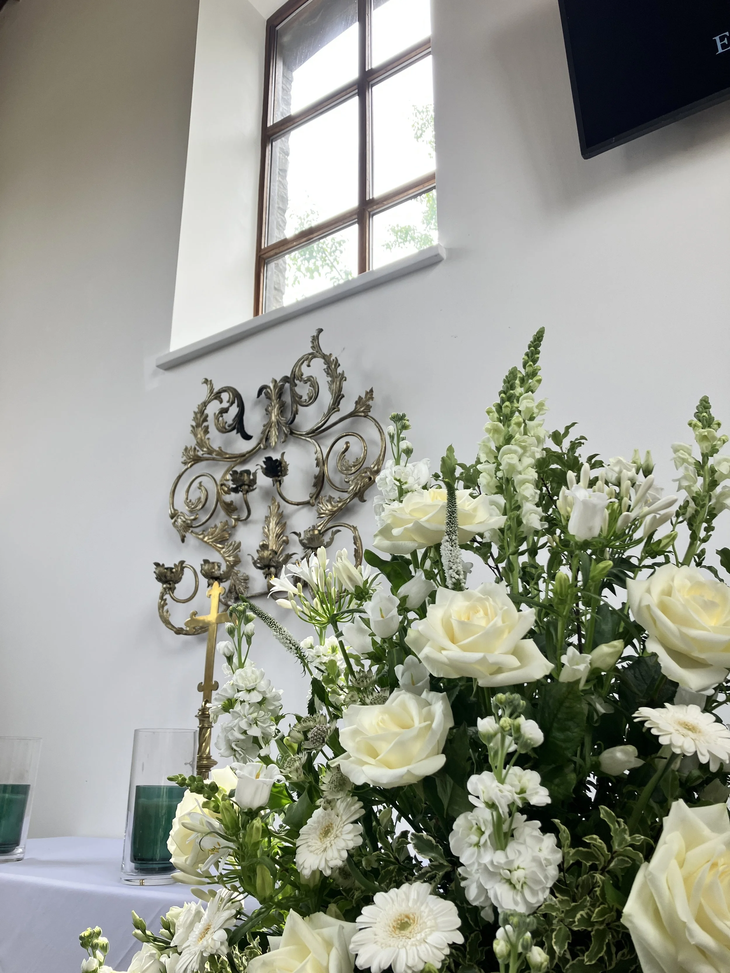 Flowers on display at Bristol Memorial Woodlands venue in South Gloucestershire where Ben Humphries is organist for this funeral service