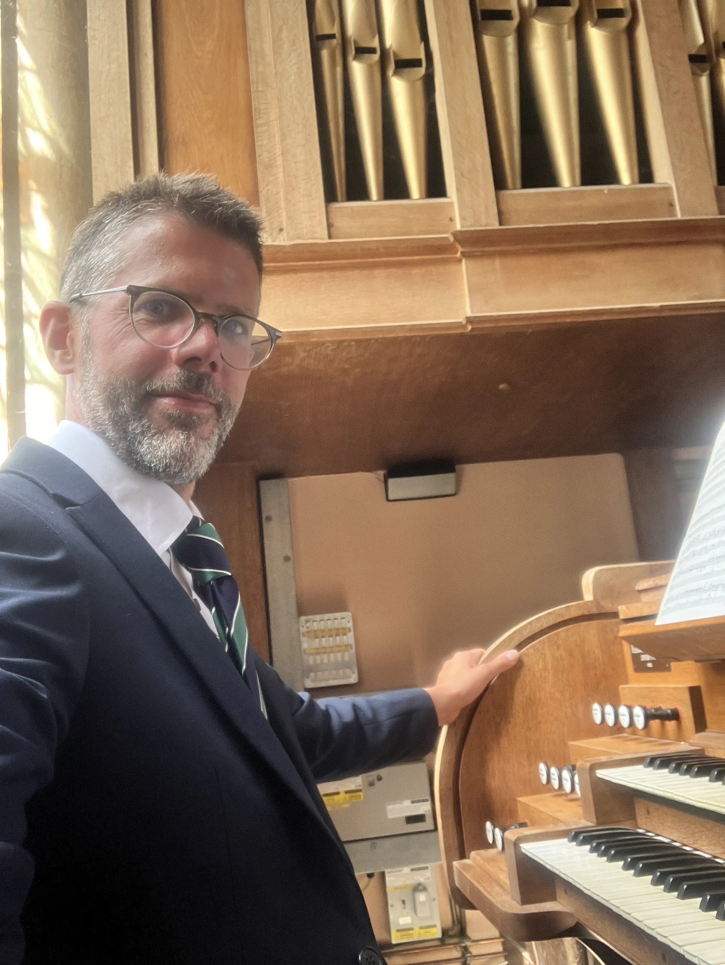 Ben Humphries playing the organ at Westonbirt School Chapel in Gloucestershire for a summer wedding ceremony