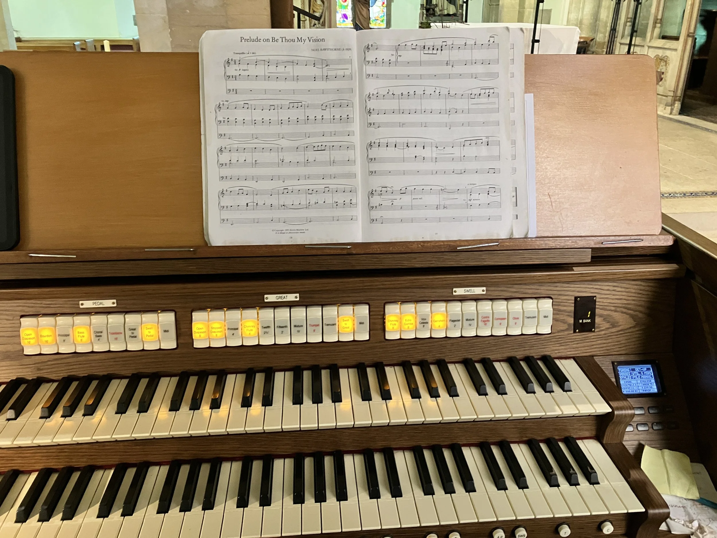 Organist Ben Humphries has his sheet music ready for the funeral service near Stroud, the Priory Church of the Annunciation in South Woodchester where Ben is playing the organ.
