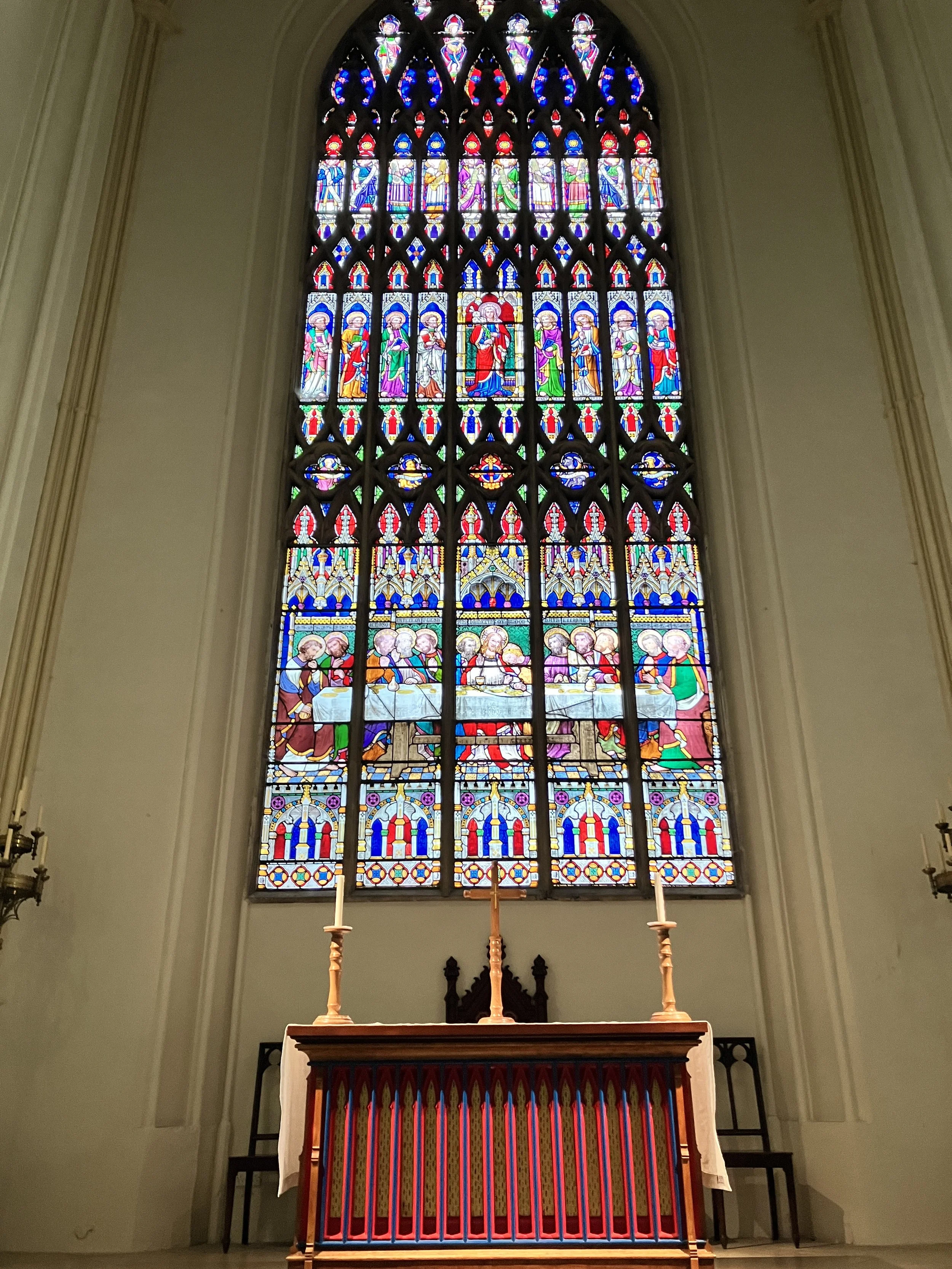 The beautiful nave alter at St Mary's Church in Tetbury, Gloucestershire with organist Ben Humphries playing gentle music at the funeral service held there. 
