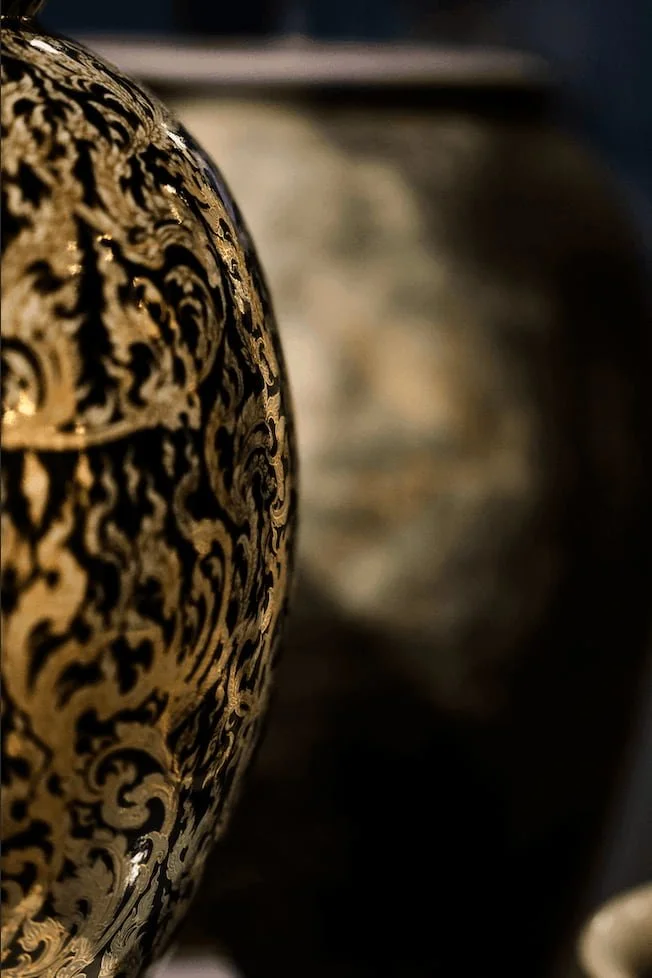 Sophisticate Thai pottery in gold representing the texture and layers of SMP ritual at Sydney cosmetic tattoo Salon.