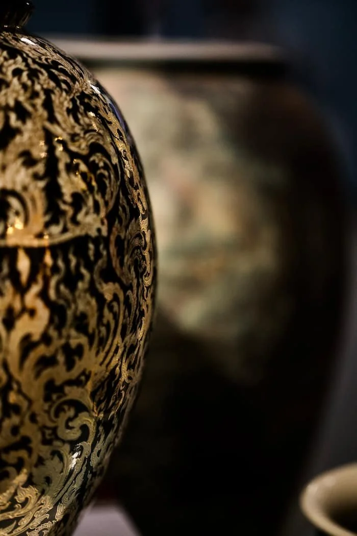 Sophisticate Thai pottery in gold representing the texture and layers of SMP ritual at Sydney cosmetic tattoo Salon.