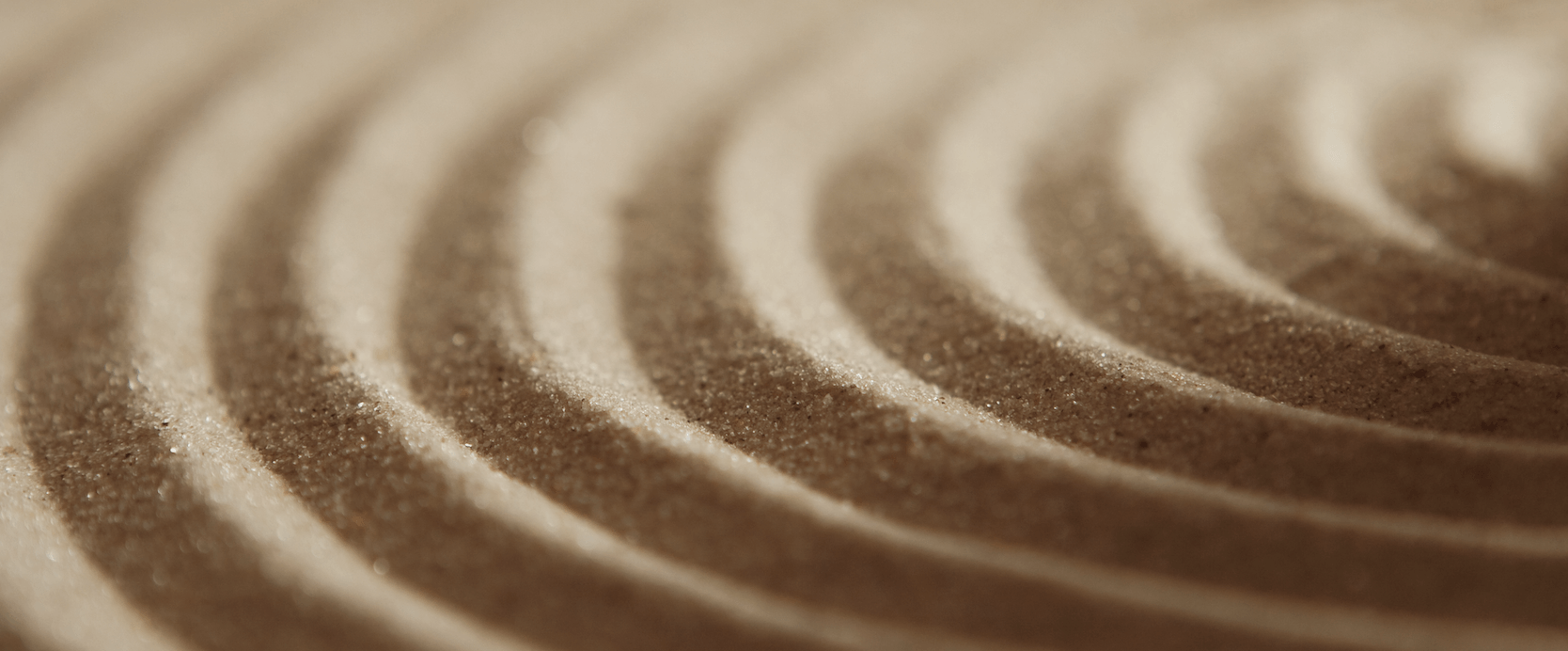 Close-up of a spiral pattern on the sand