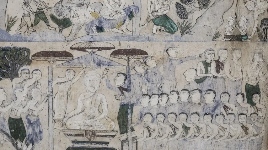 Traditional Asian mural depicting people in various activities, including dancing, talking, and sitting, with umbrellas and trees in the background.