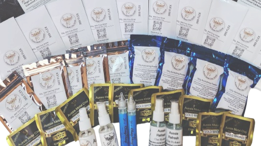 Assorted dog care products including medications, sprays, and supplements displayed on a table.