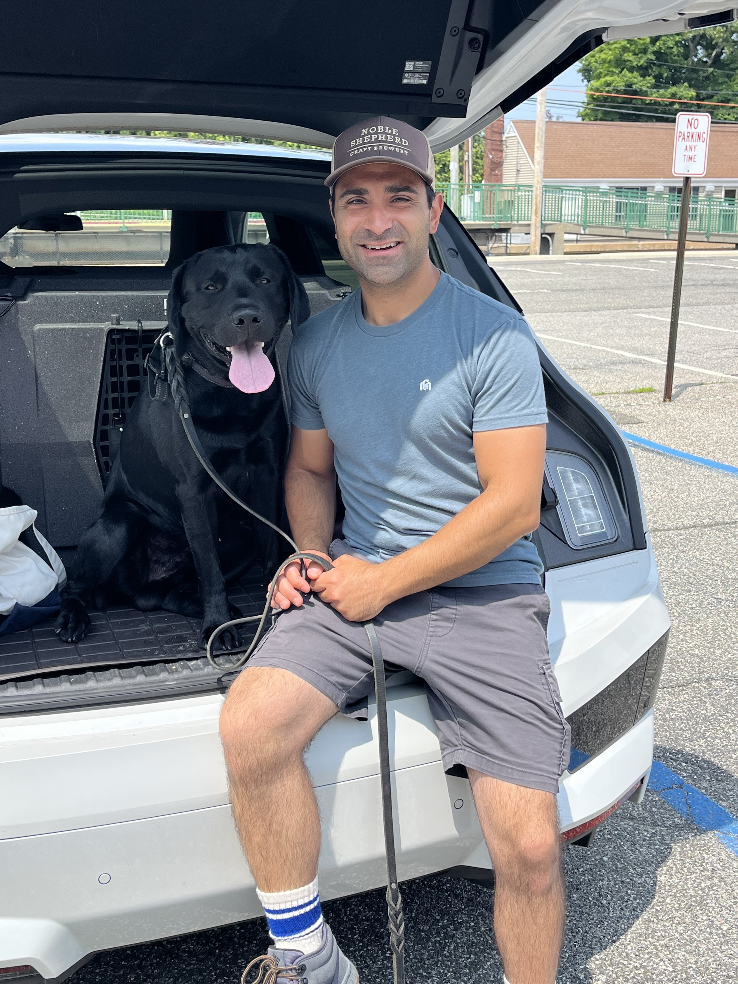 Dog trainer with black Labrador